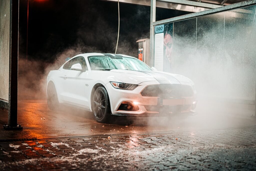 Ford Mustang GT 5.0 Fastback in a car wash at night